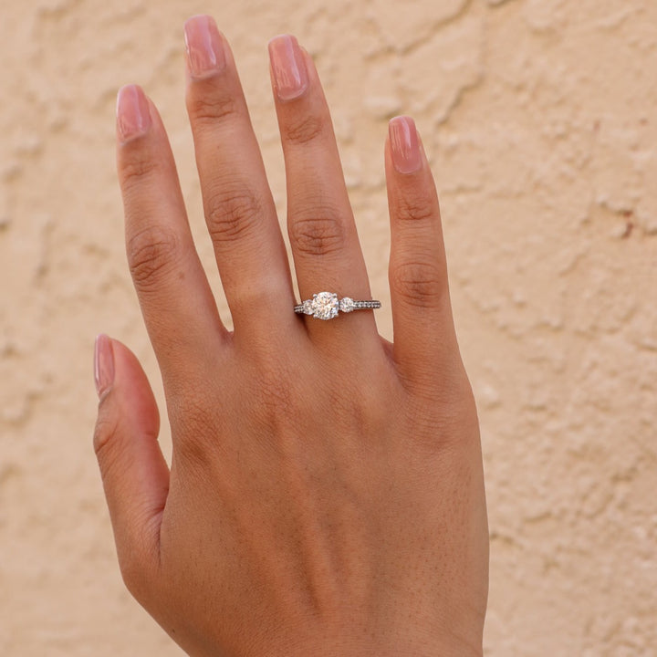 1 1/2 ctw three-stone round french-set diamond engagement ring