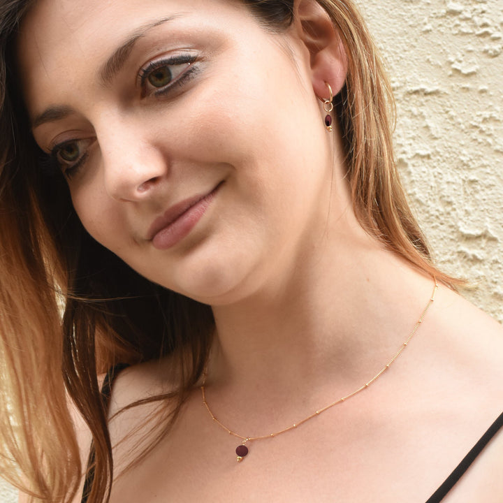 golden rondelle necklace - garnet coin charm - workshopunderground.com